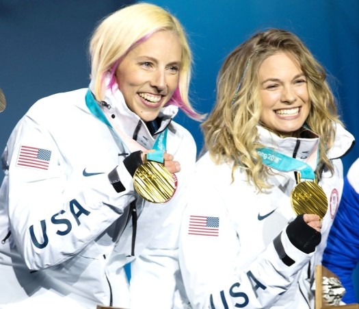 Kikkan Randall (l) and Jessie Diggins with their Olympic gold medals [P] Sarah Brunson/USSA