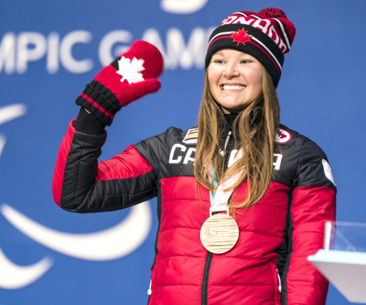 Brittany Hudak collects her bronze medal for the women's biathlon 12.5km standing [P] Canadian Paralympic Committee