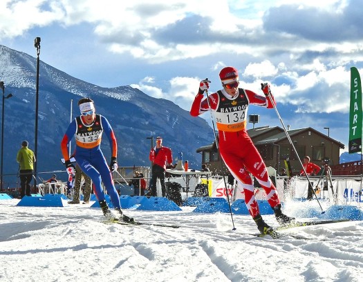Graham Nishikawa of the Canadian Para-nordic Team rounds a corner on his way to a 3rd place finish. Reed Godfrey of Team R.A.D follows [P] Drew Goldsack