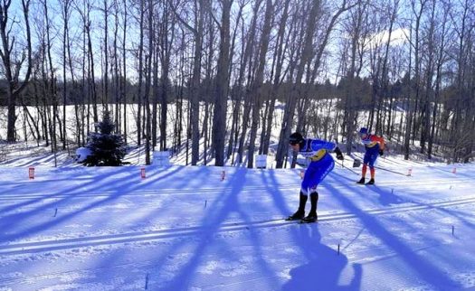 Julien Locke leads Dominique Moncion-Groulx into the finish [P] Ski de Fond Quebec