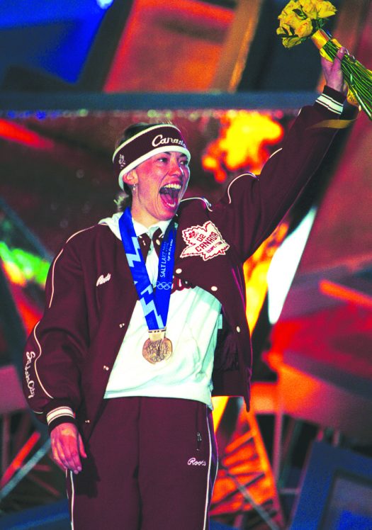 At the 2002 Olympics in Salt Lake City, Canada’s Beckie Scott celebrates breakthrough bronze which became silver and finally gold [P] Heinz Ruckemann