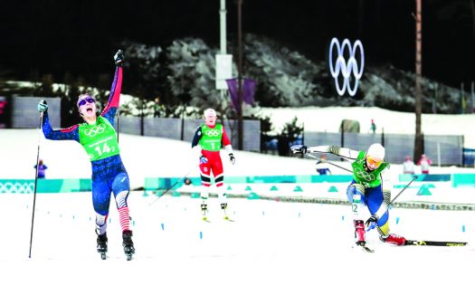 American Jessie Diggins (l) outsprints Sweden’s Stina Nilsson by a scant 0.19 seconds in the women’s Team Sprint at Pyeongchang 2018, claiming the U.S.A.’s first Olympic gold medal in cross-country skiing with teammate Kikkan Randall [P] Nordic Focus