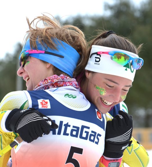 Mallory Williams, 2nd, hugged by teammate Erin Dunn, 4th, in Juvenile Girls final [P] Rob Smith