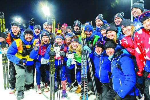 Team USA celebrates Jessie Diggins and Kikkan Randall’s historic first Olympic gold medal in cross-country skiing at Pyeongchang 2018 [P] Steve Fuller