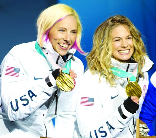 Kikkan Randall (l) and Jessie Diggins with their Olympic gold medals [P] Sarah Brunson/USSA