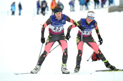 Libby Tuttle (Loppet Nordic Racing/Midwest), left, and Stephanie Nicols (St. Lawrence University Nordic/New England) crest a hill during the women’s U18/U20 5K individual freestyle [P] Michael Dinneen