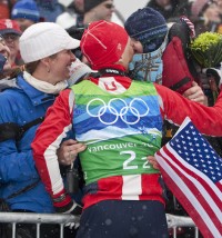 Todd Lodwick (USA) climbs the grandstands to hug his family. [P] Heinz Ruckemann
