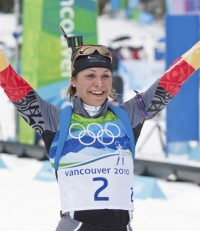 Magdelena Neuner (GER) celebrates winning gold. [P] Heinz Ruckemann