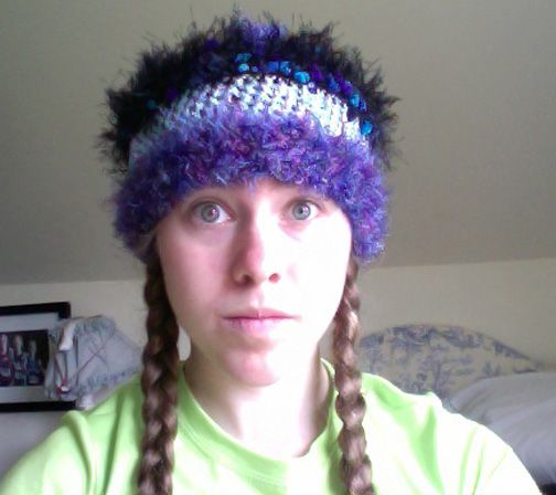 Modeling one of the 20-plus crocheted...