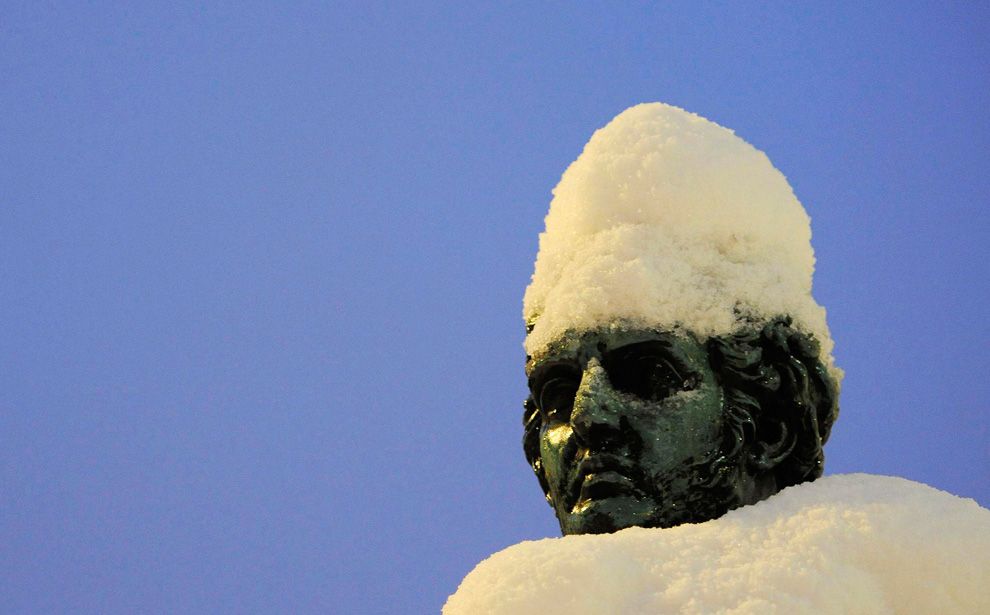 Snow covers a statue in Newcastle,...