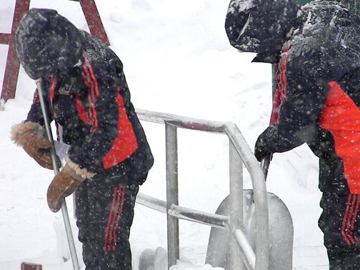 Organizers hard a work clearing snow....