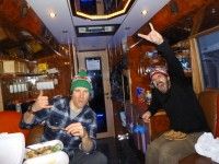 Devon The Champ and WolfMan (he might look scary, but he is a great massage therapist) on one of a kind Tour de Ski Bus. [P] Ivan Babikov