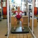 Squat test- we push against this bar that is impossible to move to measure the force we put on the scale below our feet [P] courtesy of Sadie Bjornsen