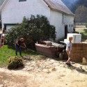 Middlebury team members clean up what’s left of the garden. [P] Middlebury Ski Team