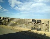 Just 1 of the 4 semis I saw ‘tipped’ over in the ditch, victim of the insane strength of the wind that day.  [P] Heidi Widmer