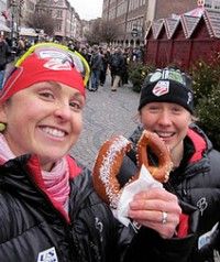 Holly shares a fresh German pretzel with her team mate. [P] courtesy of Holly Brooks