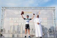 Mark Cavendish on the podium after his third consecutive stage win. [P] Mark Cavendish scores a hat trick with a win on Stage 5. [P] Tim De Waele