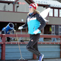 Cross country ski team member Dahria Beatty runs with wings as she help out the kids relay race [P] Pam Doyle