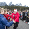 National Men’s Cross Country Ski team coach Ivan Babikov high fives kids at the Frozen Thunder cross country ski track [P] Pam Doyle