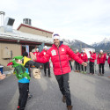 Len Valjas high fives kids in Halloween costumes at the Frozen Thunder Festival [P] Pam Doyle