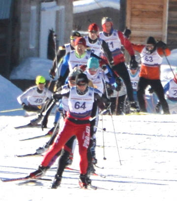 Single file racers near the barn...